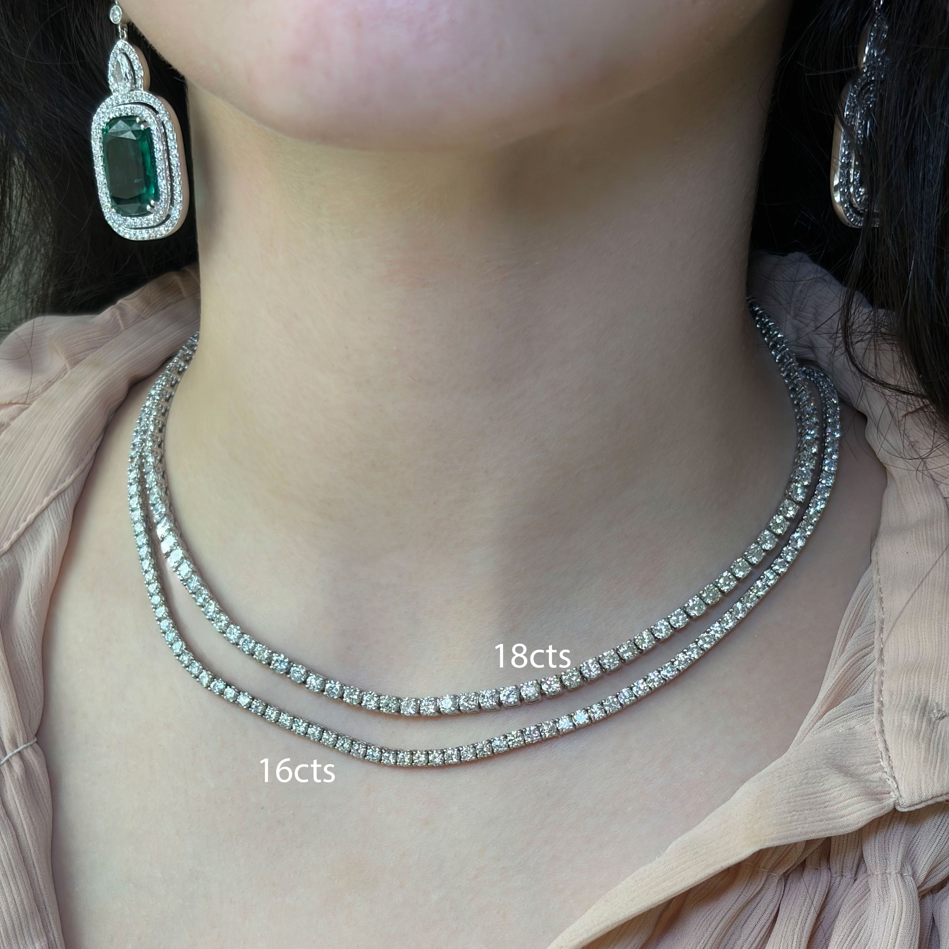 Necklace with two strands labeled '16cts' and '18cts' on a person wearing a light-colored top.