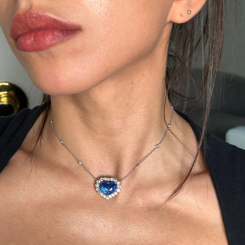 Blue sapphire heart pendant with diamond halo in 18K white gold, luxury fine jewelry