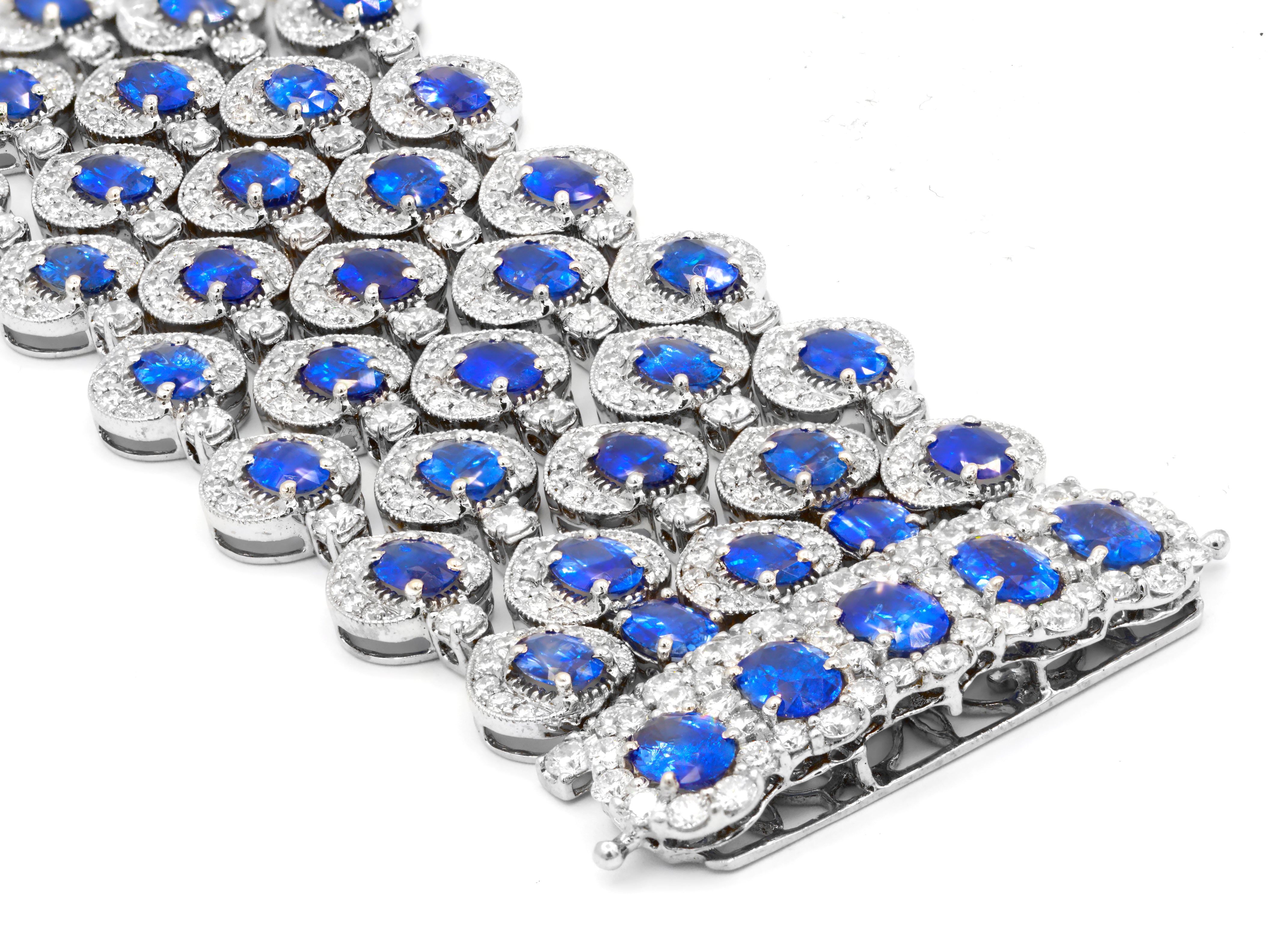 Bracelet with blue gemstones and clear stones on a white background