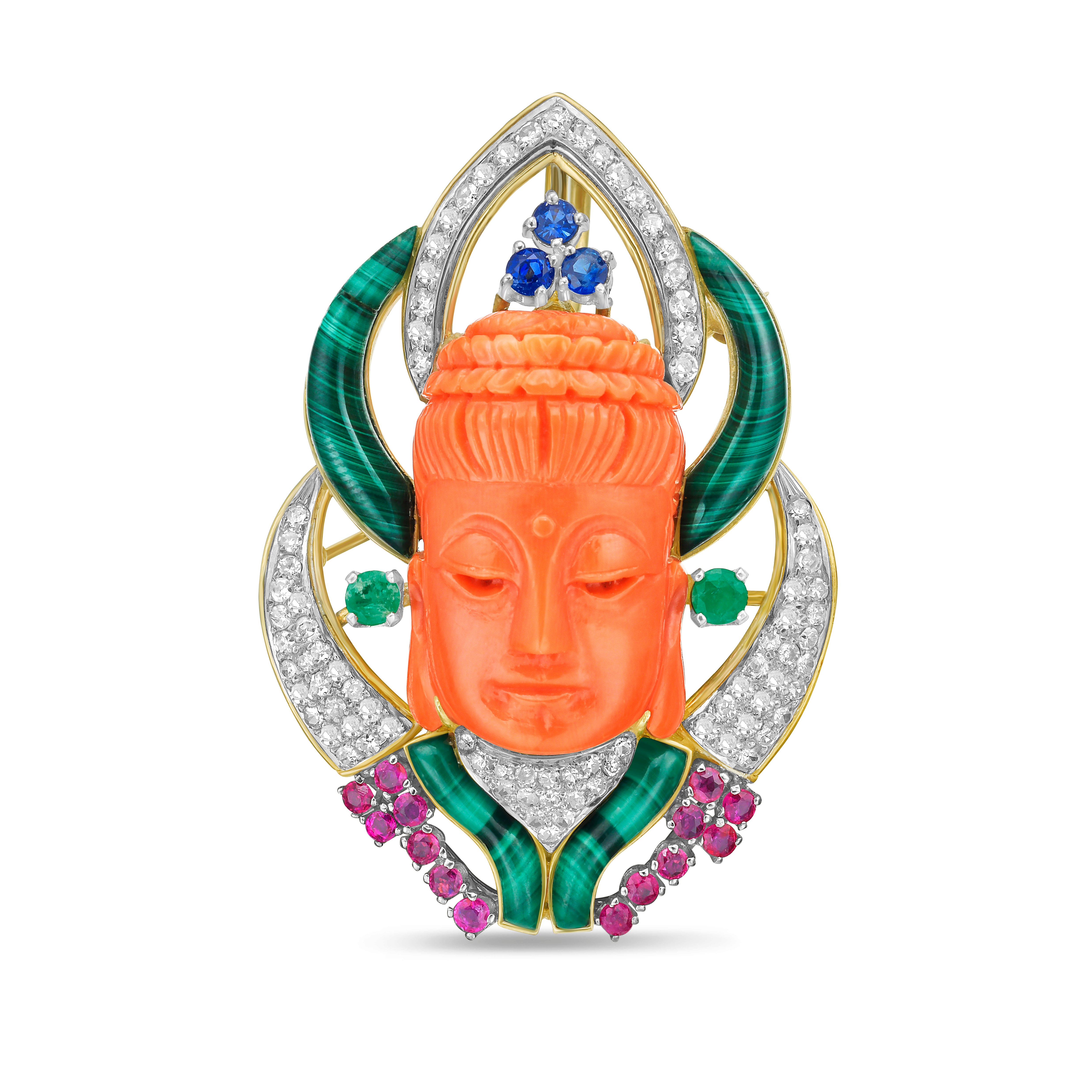 Ornate jewelry piece with coral face, gemstones, and gold frame on a white background