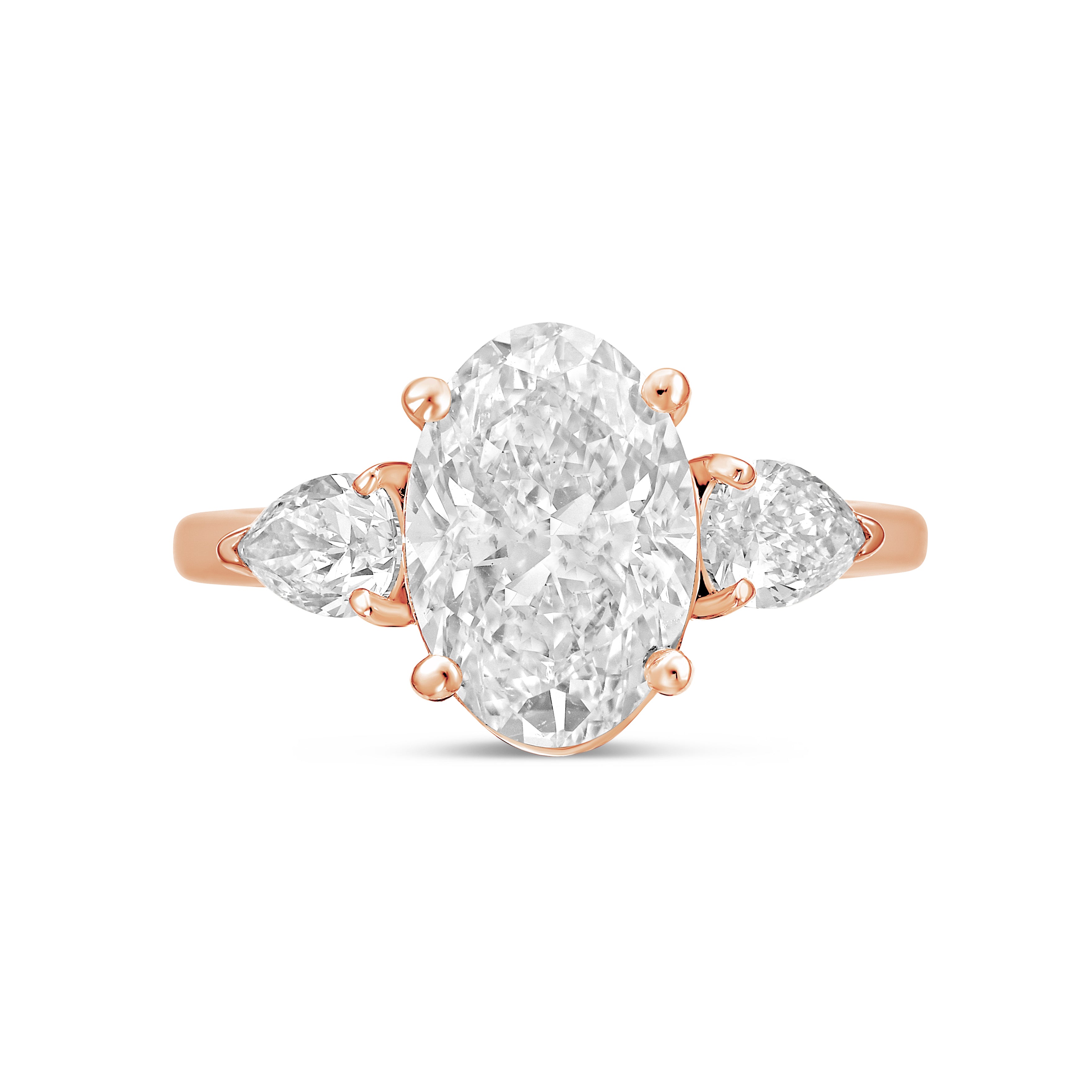 Lab-grown oval and pear three-stone engagement ring in 18kt rose gold, front view