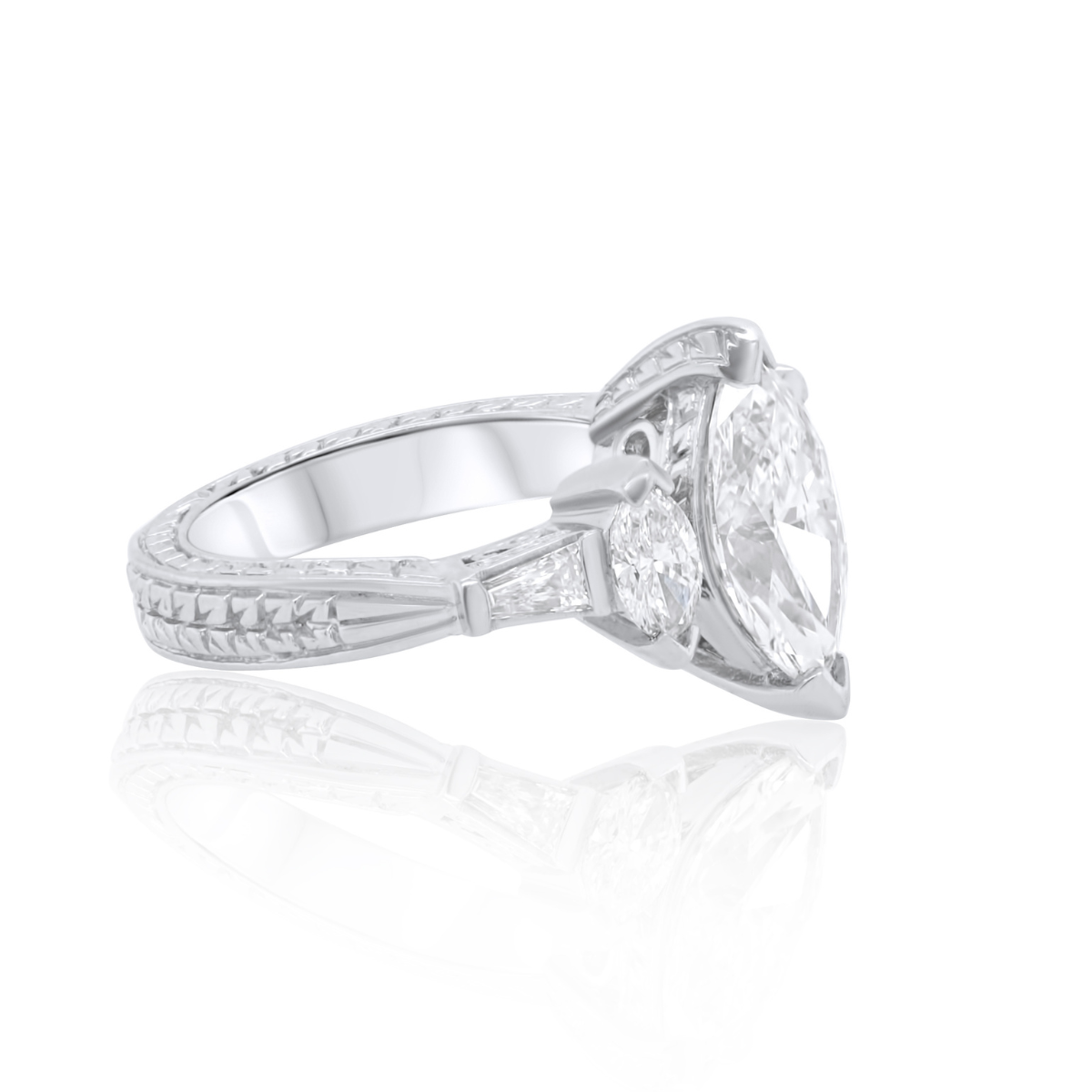 Elegant three-stone platinum marquise engagement ring