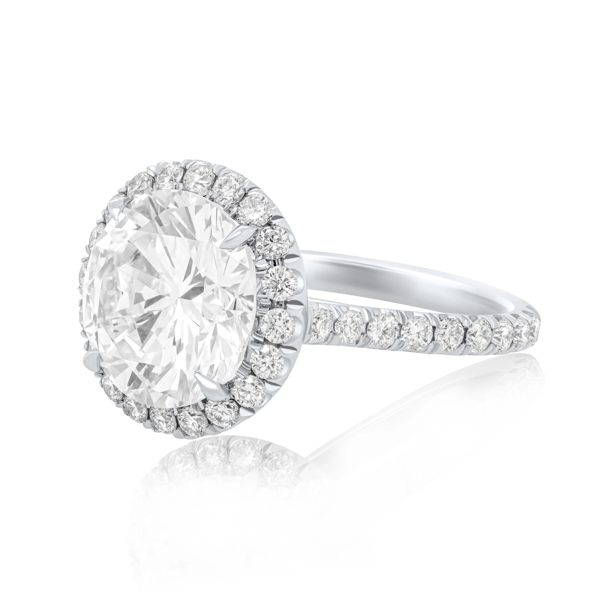 GIA-certified round diamond with micropavé halo setting
