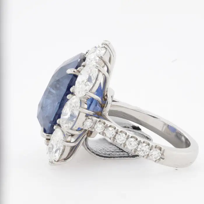 GRS certified blue sapphire statement ring with large diamond halo in platinum