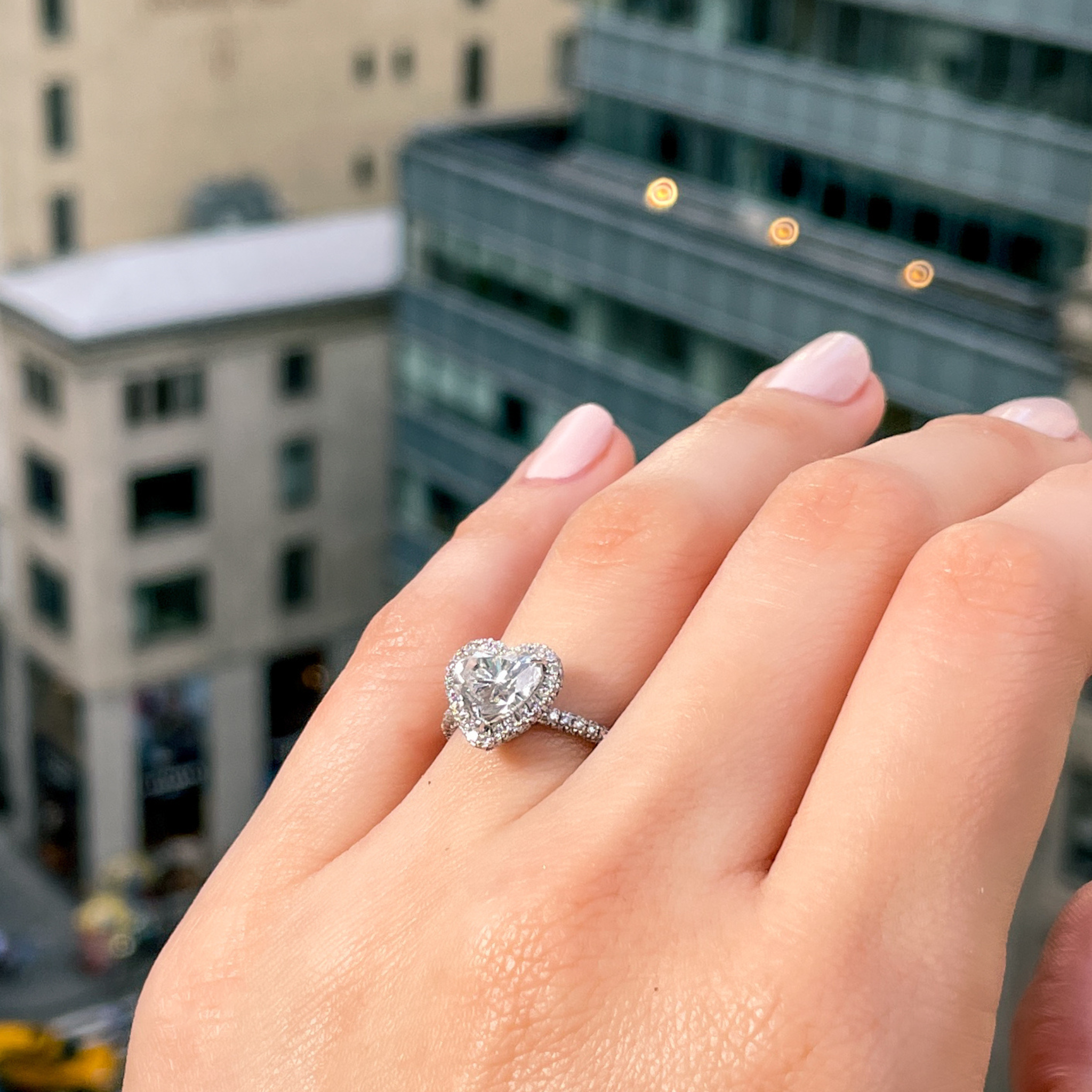 Heart-shaped diamond halo engagement ring, platinum setting
