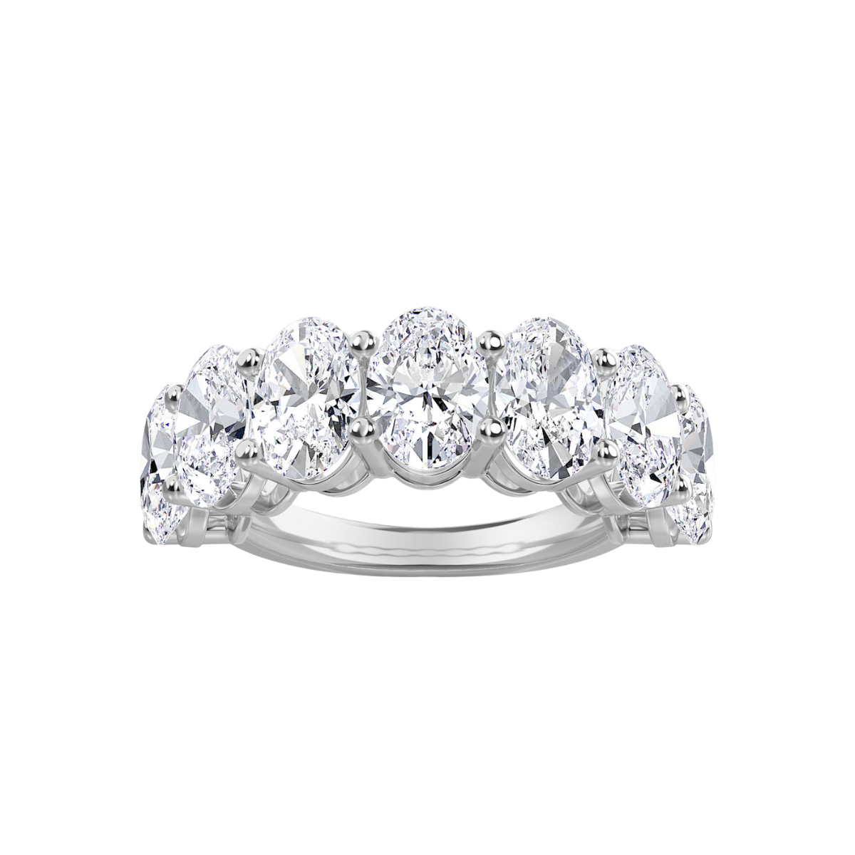 A 14kt white gold band with seven lab grown oval cut diamonds set in it.