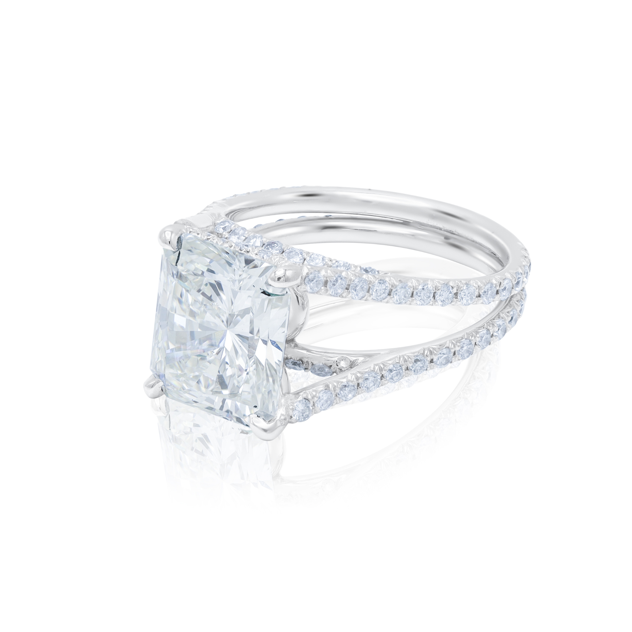 Radiant cut diamond three-stone engagement ring with split shank