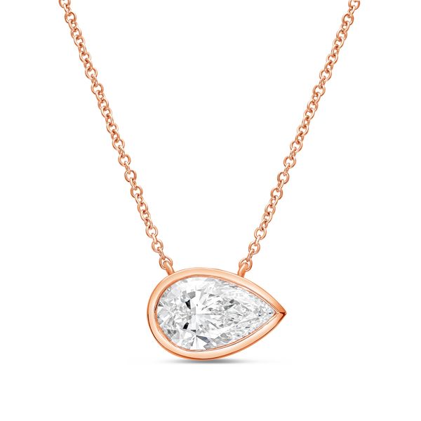Rose gold necklace with a pear-shaped diamond pendant on a white background