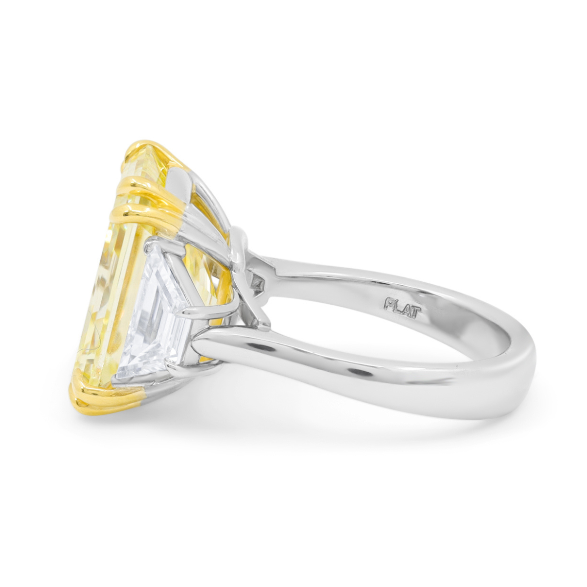 Three-stone yellow diamond engagement ring with mixed metal setting