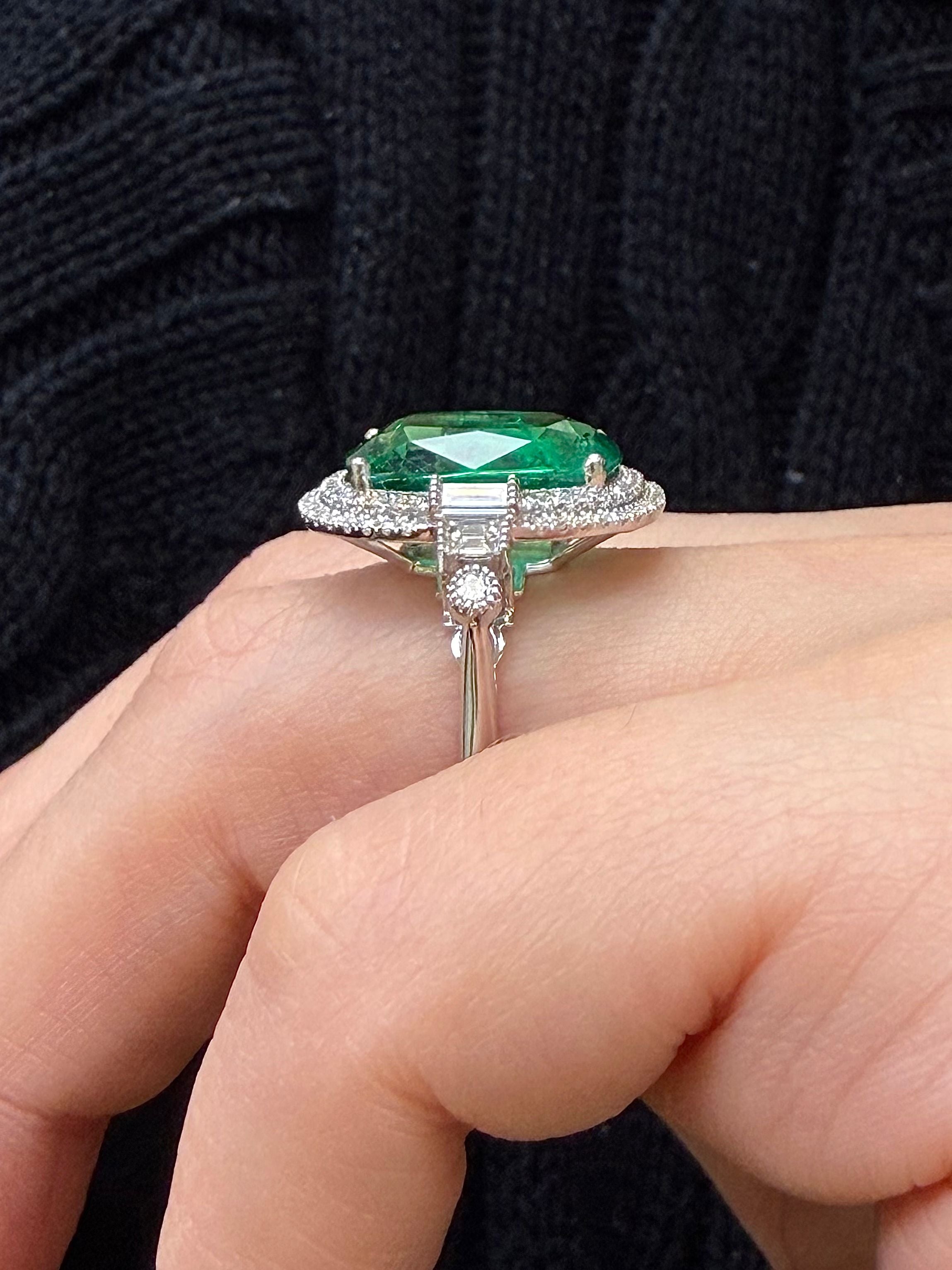 White gold emerald statement ring with double halo and pavé band