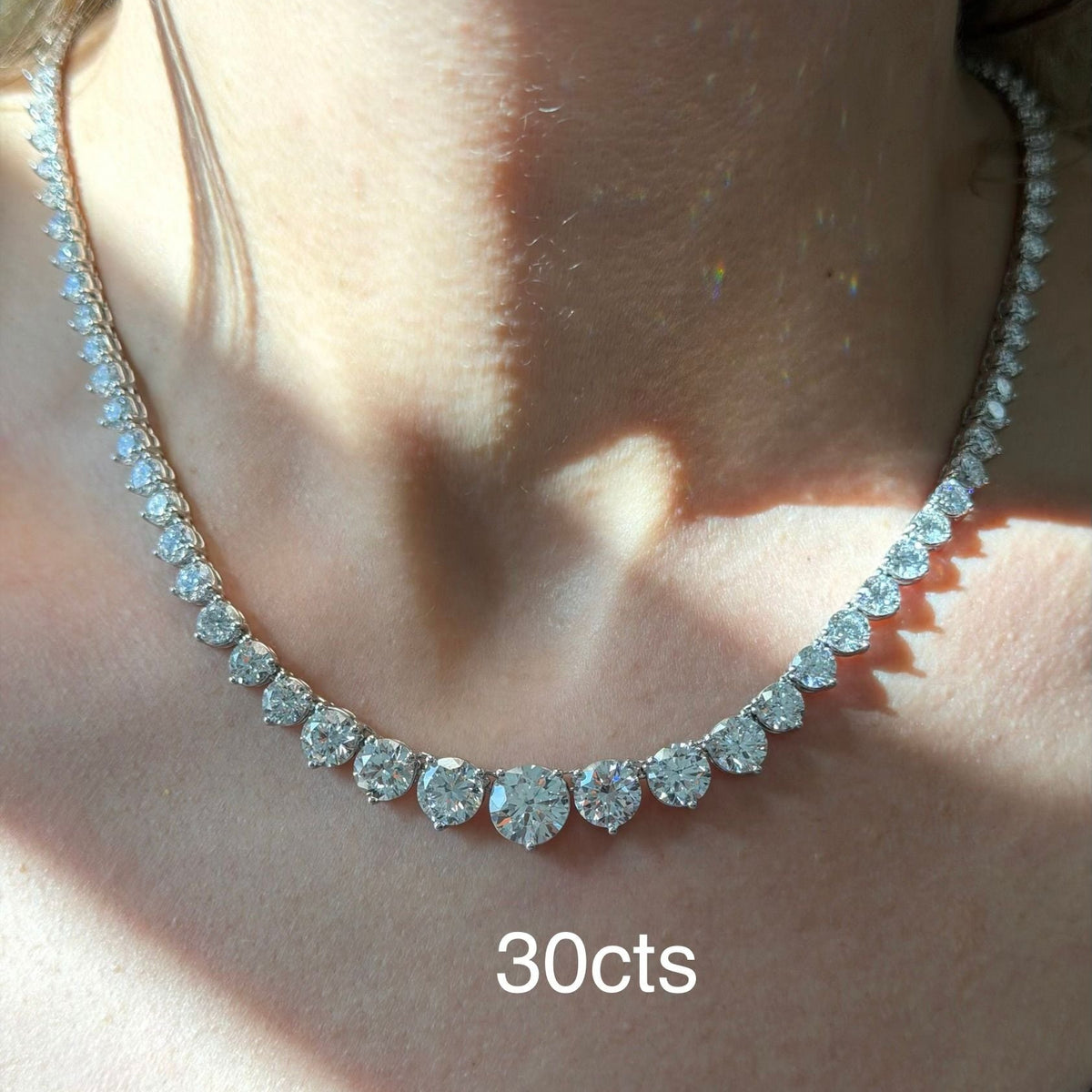 Diamond necklace with 30 carats on a person's neck