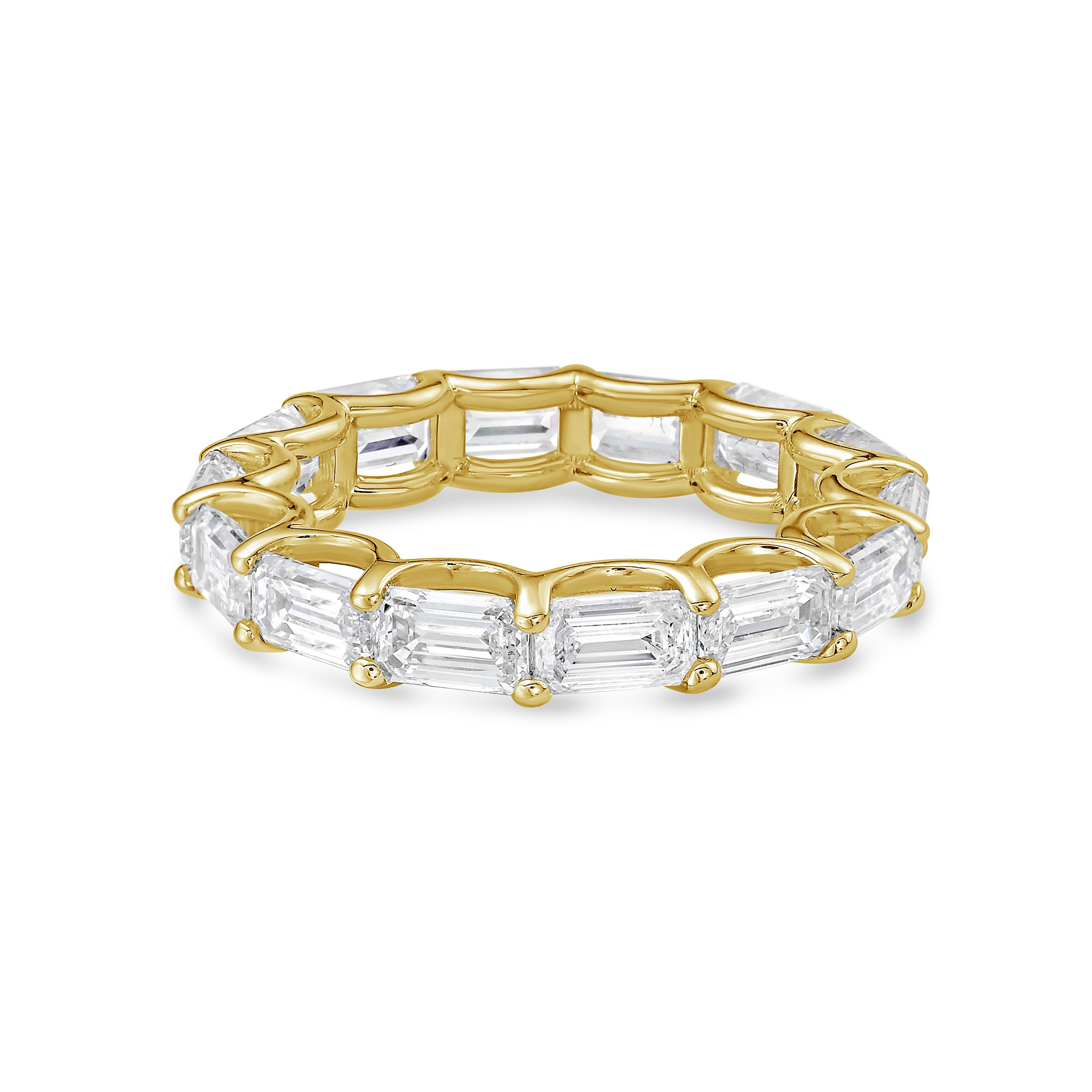 east west emerald wedding band