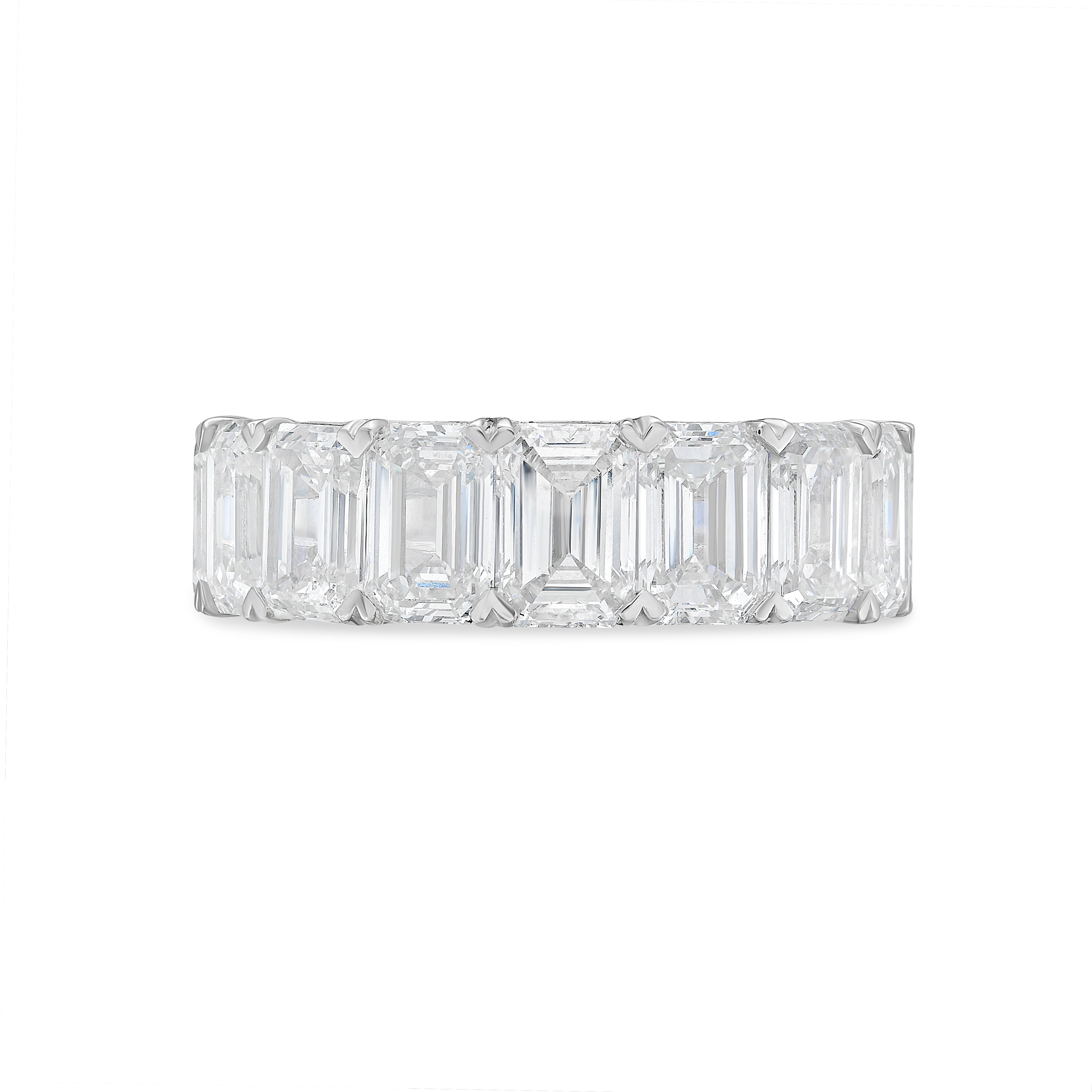 Side profile of emerald cut diamond eternity band showing low-profile basket setting