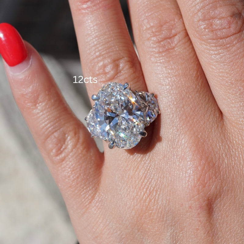 Diamond ring with 12 carats on a finger