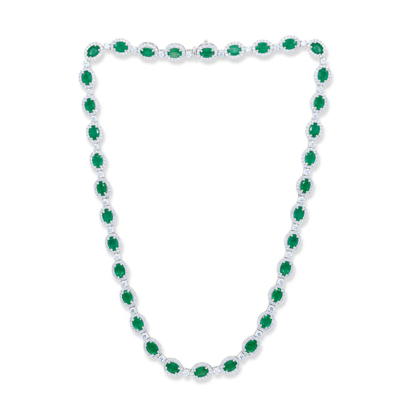 Necklace with green gems on a white background