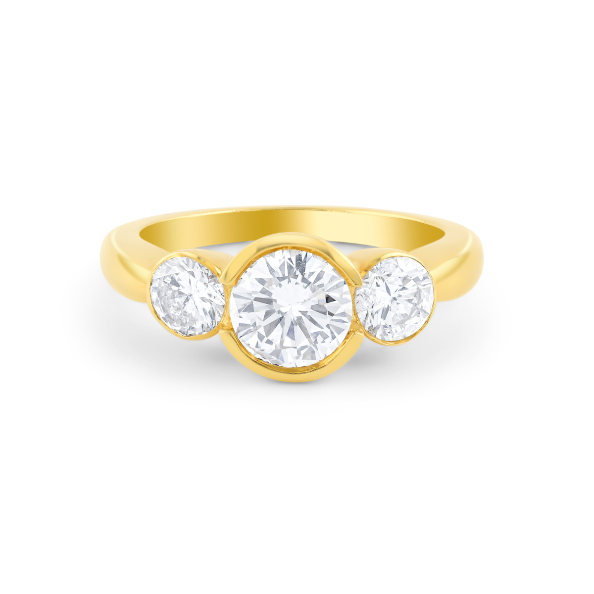 Bezel set three stone diamond ring in 18kt yellow gold
