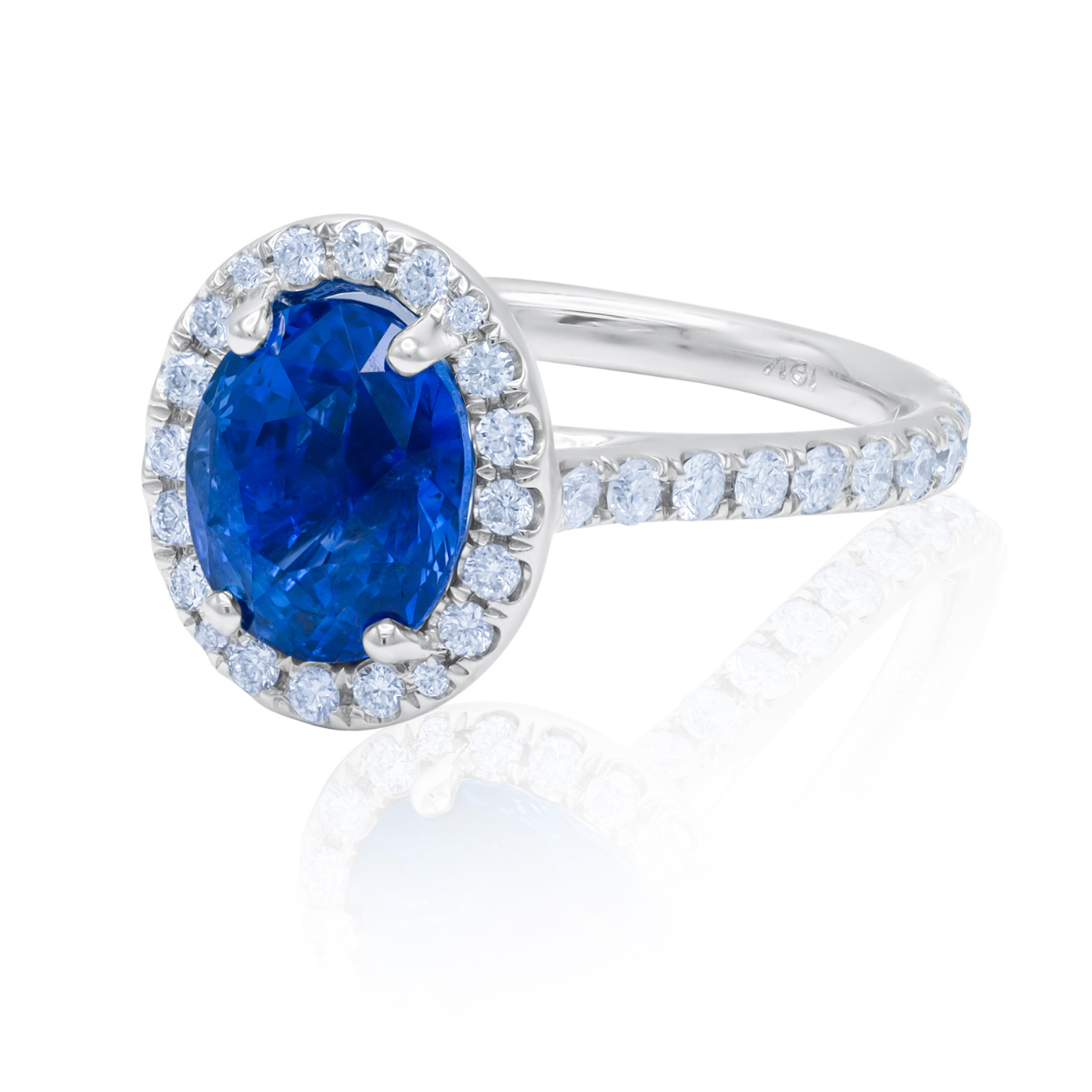 C.Dunaigre certified oval sapphire micropavé halo ring in 18kt white gold