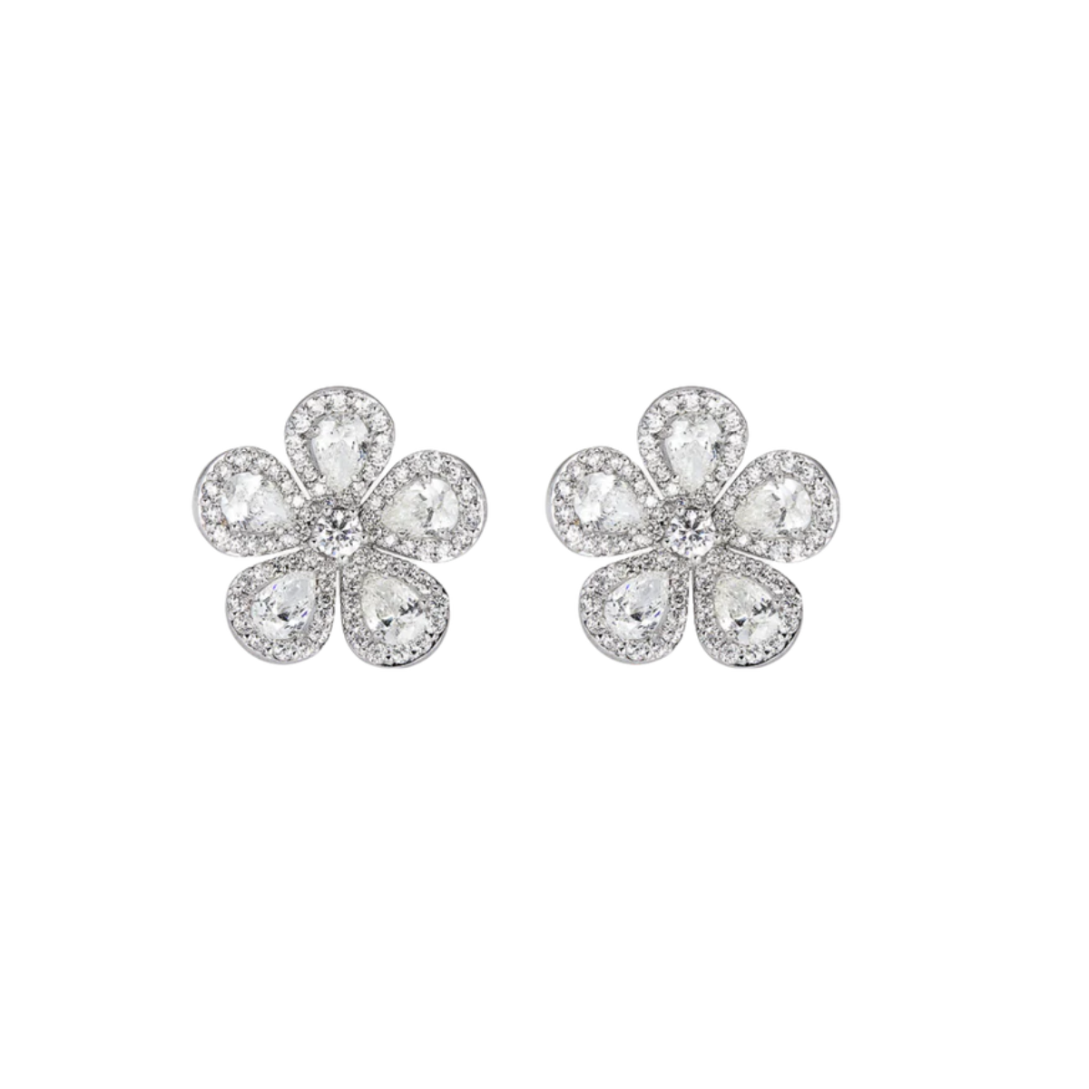 A pair of 18kt white gold diamond flower stud earrings with pear and round orange sapphires and round diamonds.