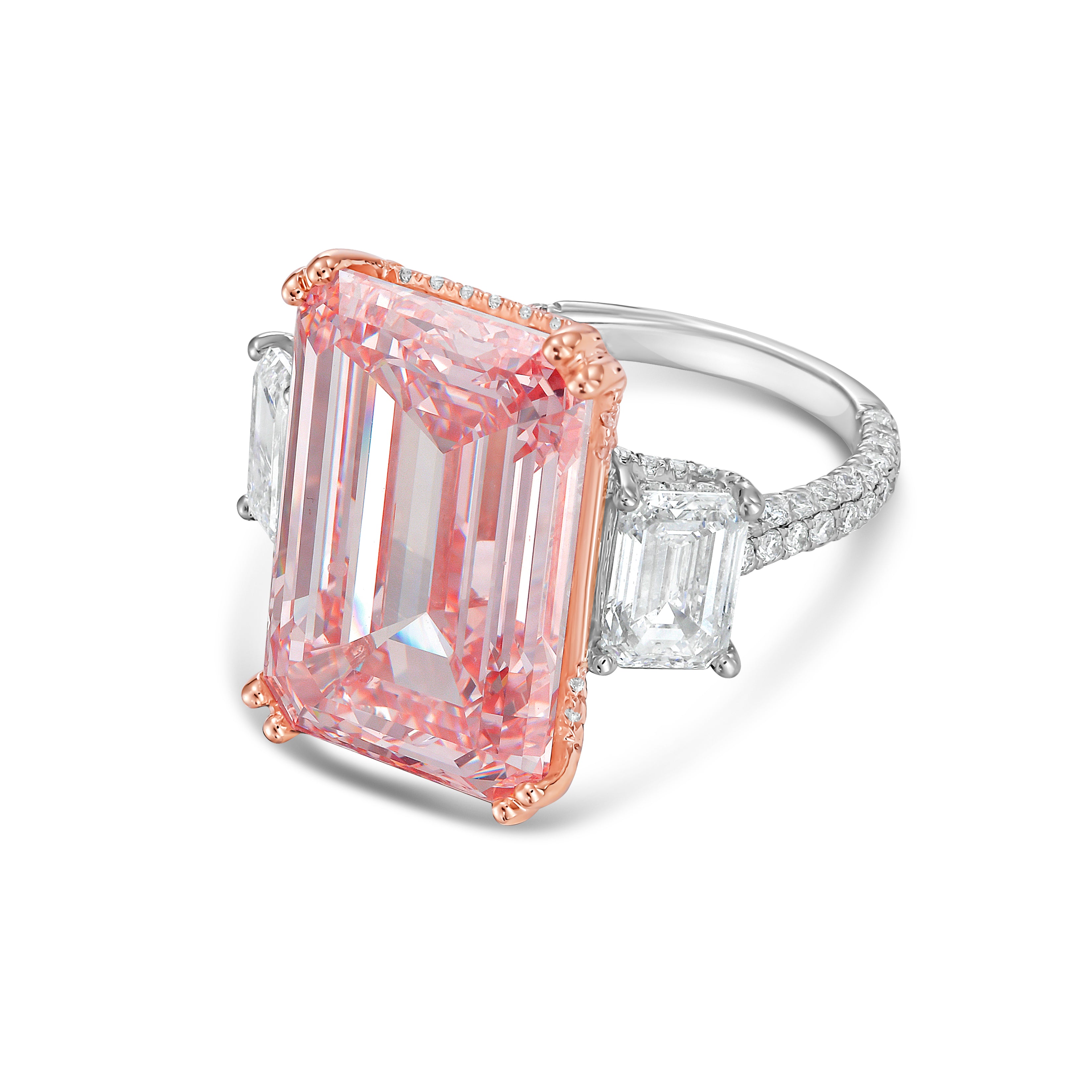 Ring with a pink emerald-cut diamond and diamond accents on a white background