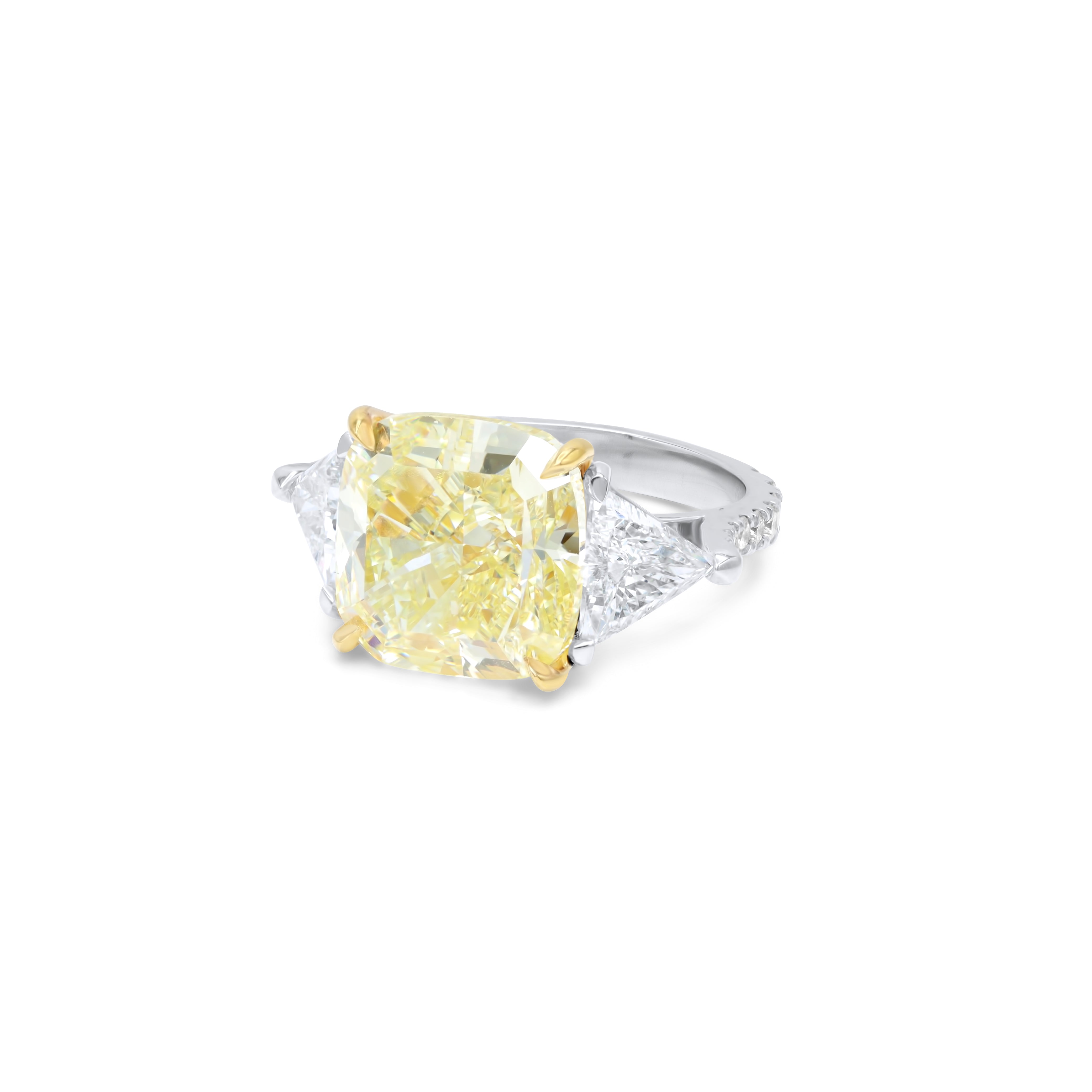 Fancy yellow cushion cut engagement ring with trapezoid sides