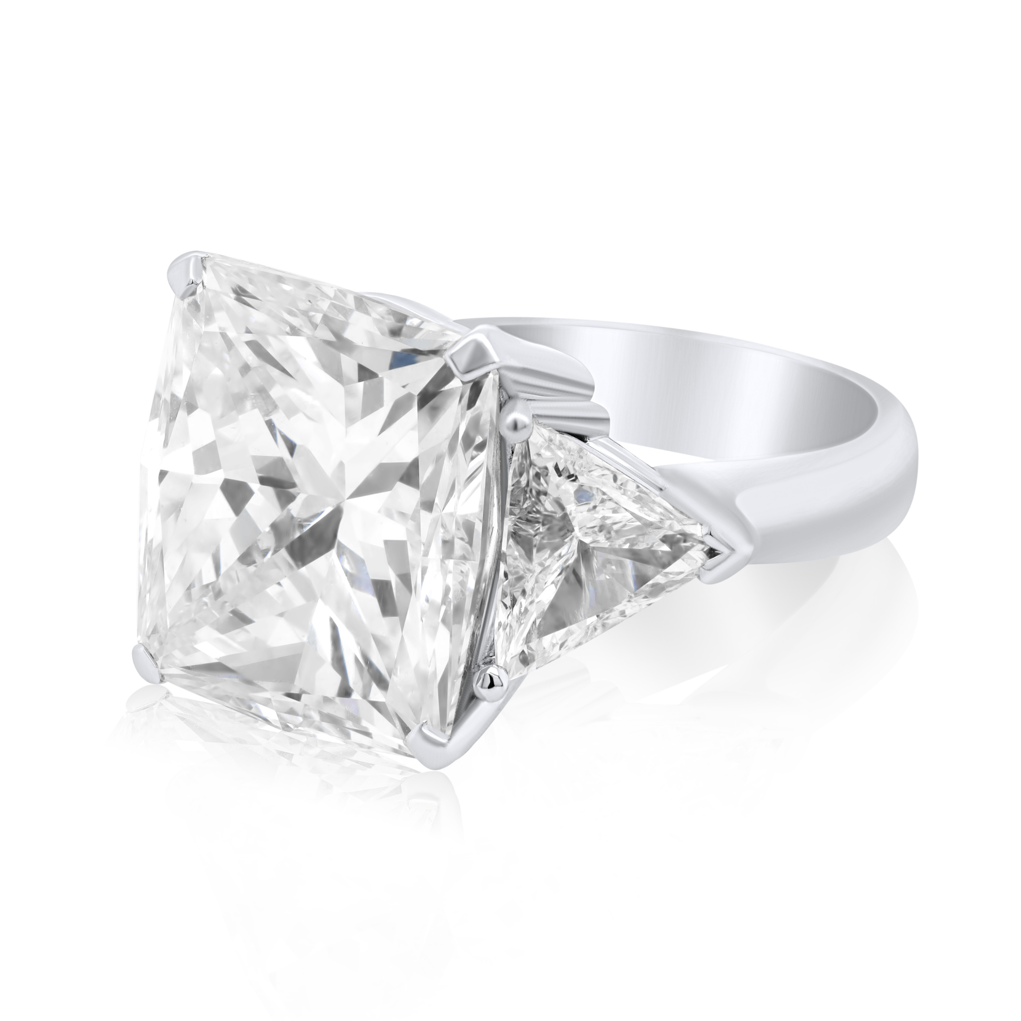 GIA certified radiant cut three-stone platinum engagement ring