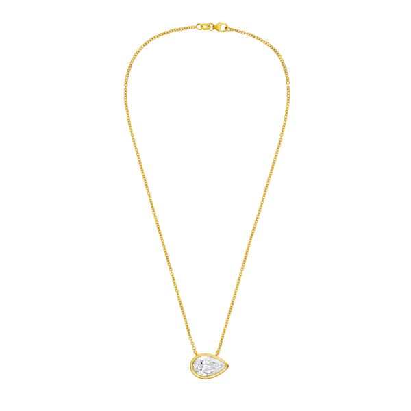 Gold necklace with a clear pendant on a white background