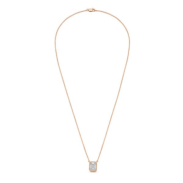 Gold necklace with a rectangular pendant on a white background