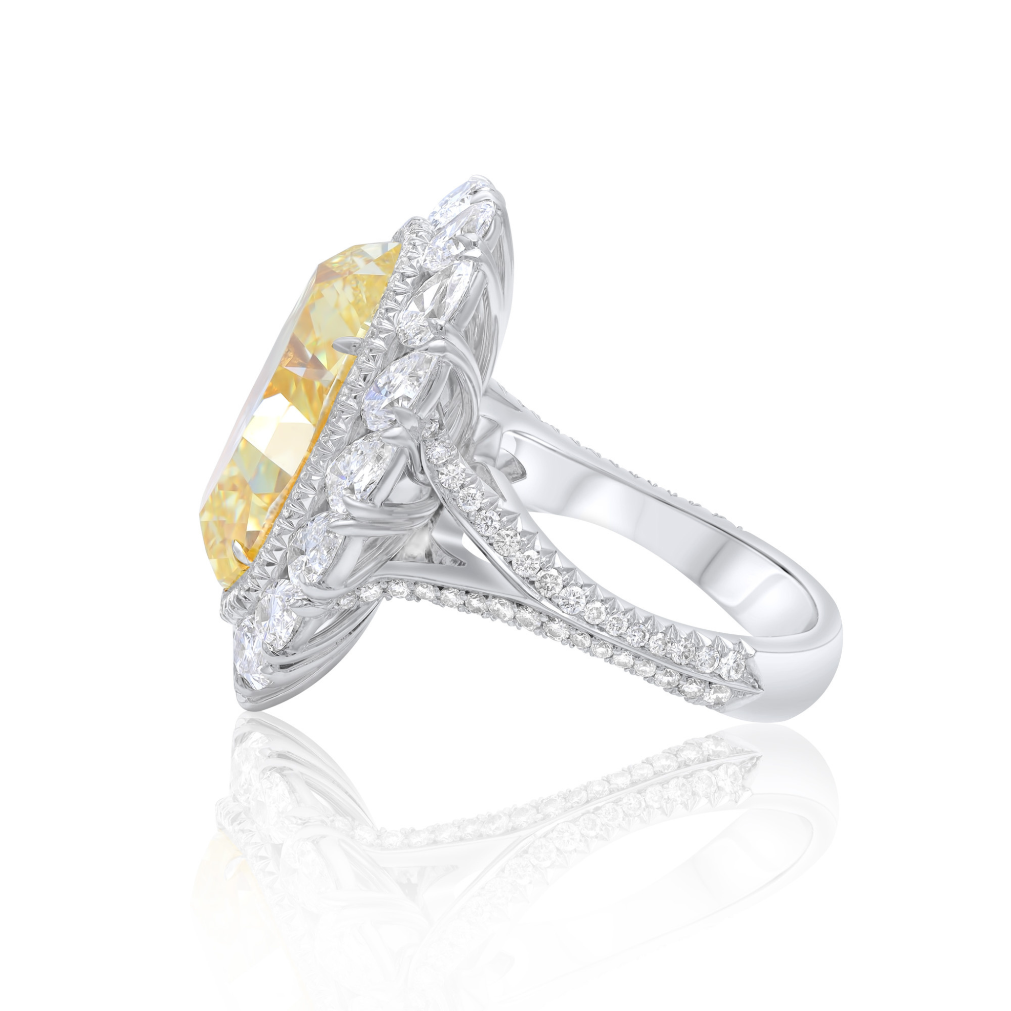 High-carat yellow oval diamond halo engagement ring