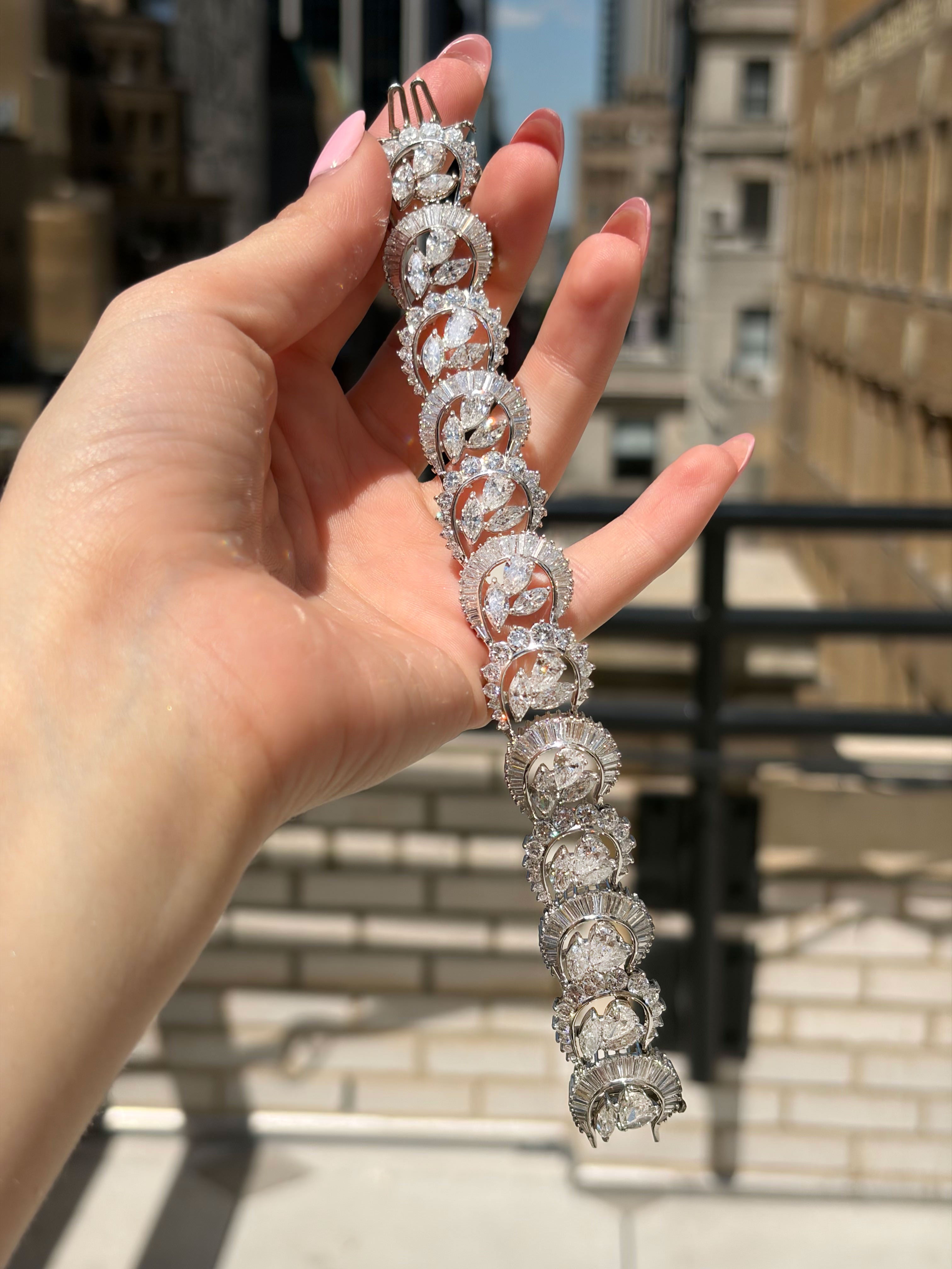 Detail of half-moon, baguette, and pear-shaped diamonds in alternating pattern on bracelet
