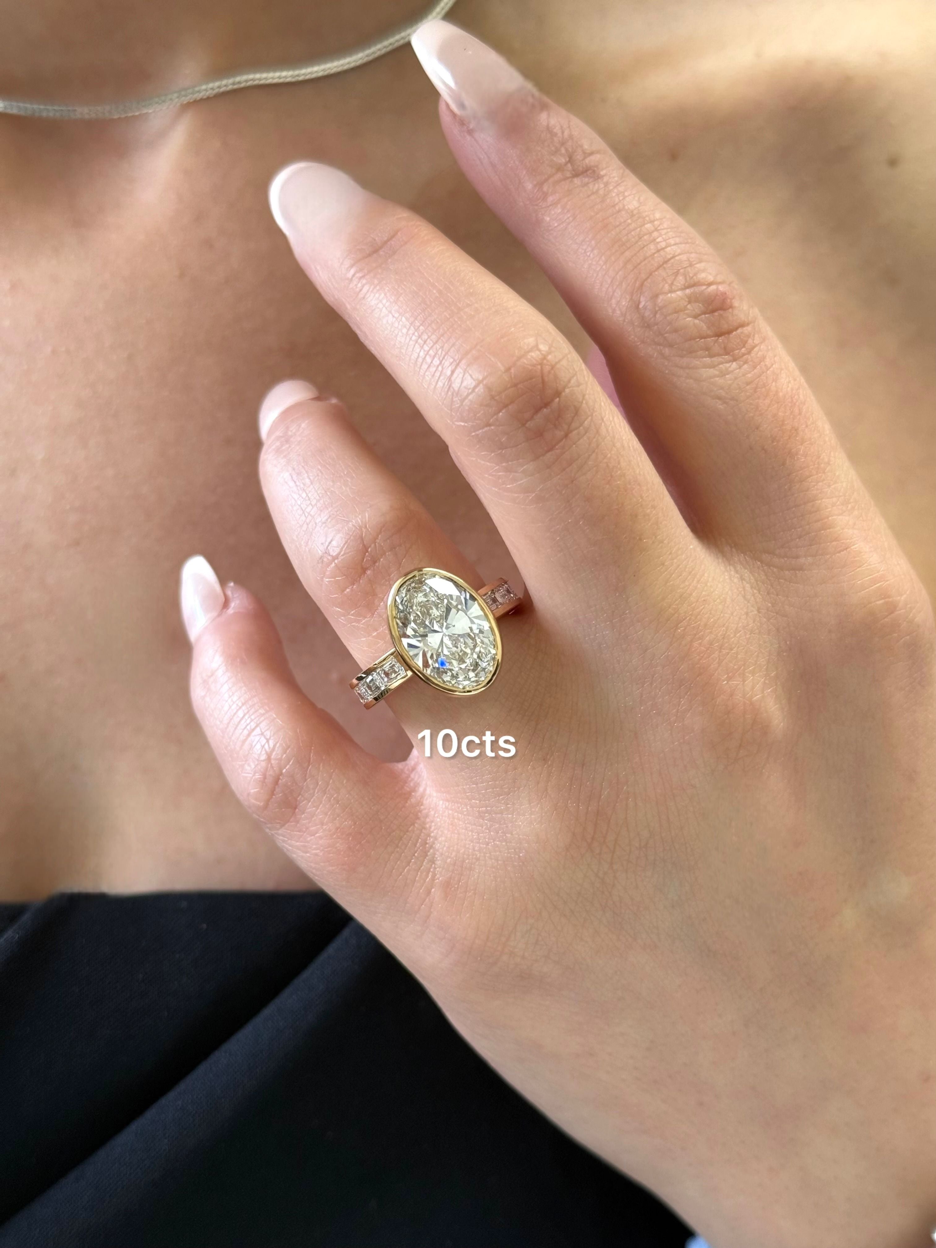 Lab Grown Bezel Oval Diamond Ring with Emerald Accents