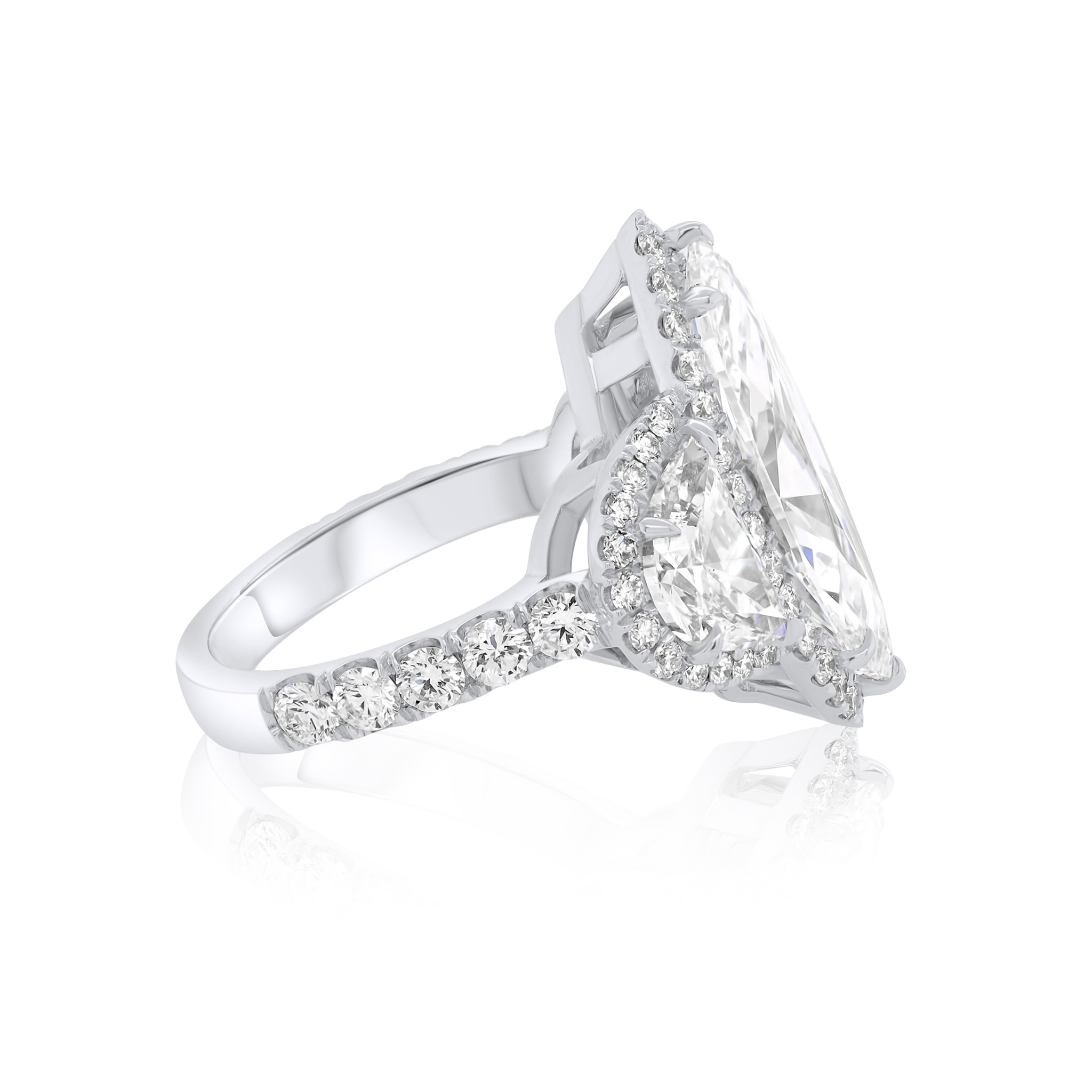 Platinum Three-Stone Engagement Ring Featuring Half Moon Diamonds