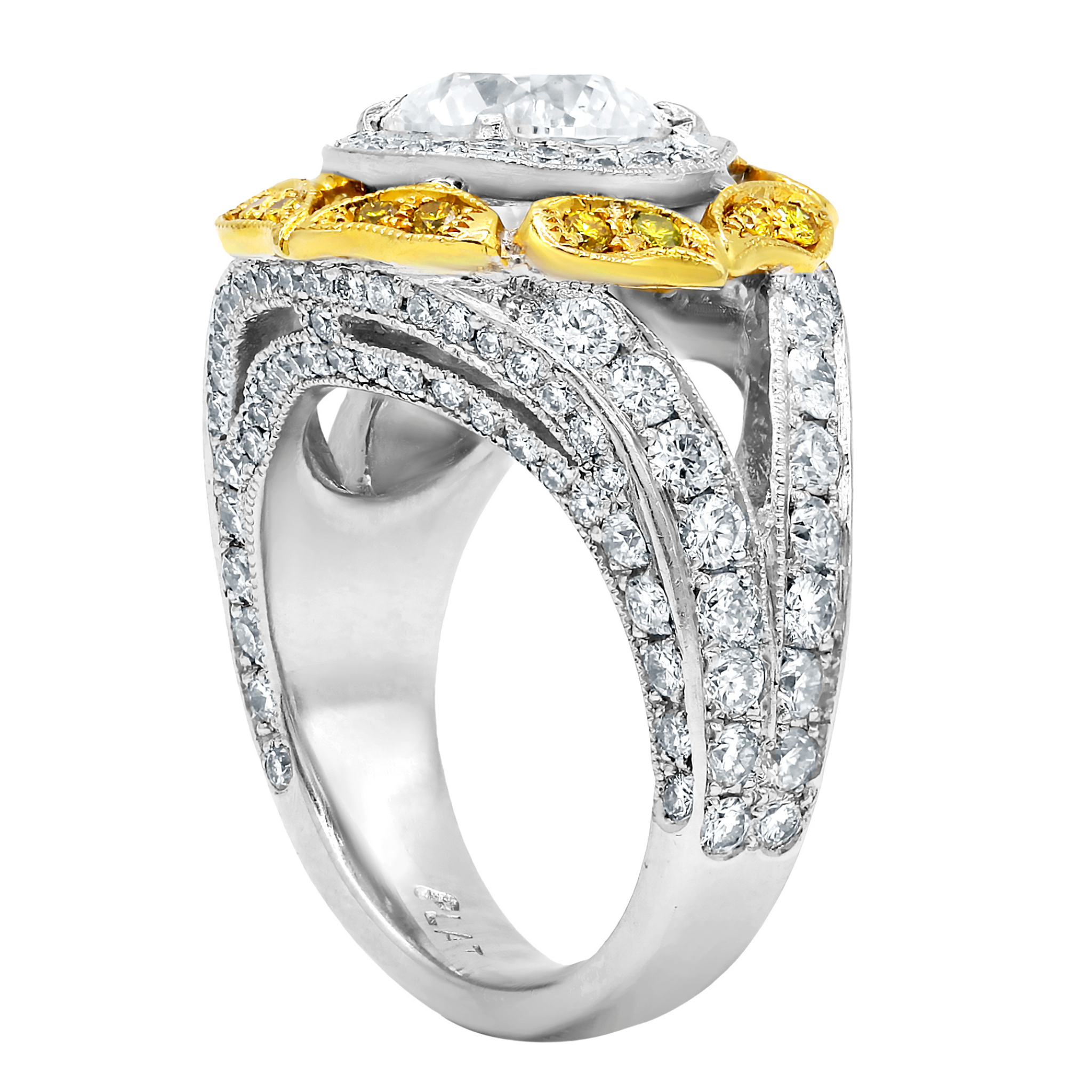 Platinum and yellow gold halo diamond ring with filigree detail