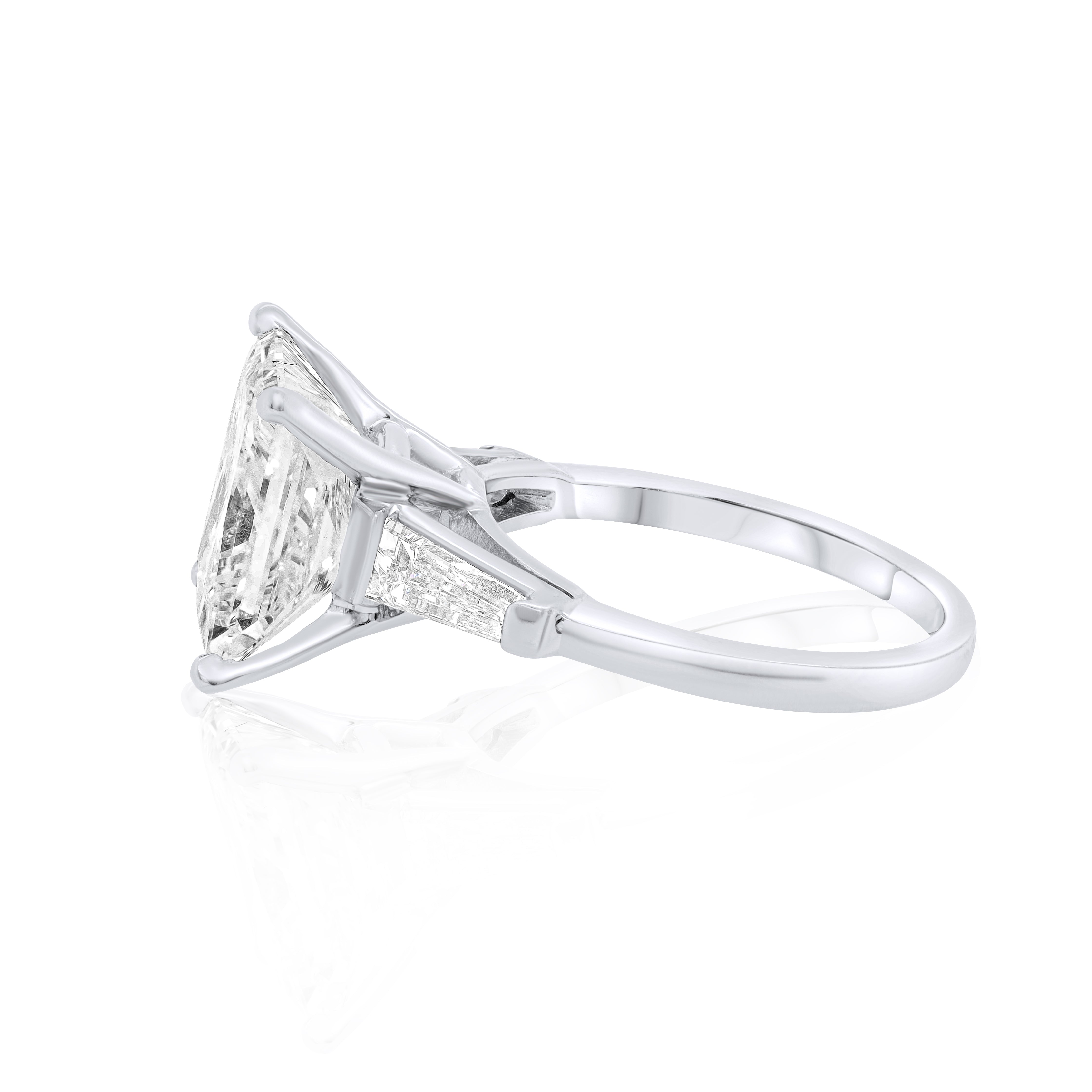 Platinum three-stone diamond ring with GIA certified center