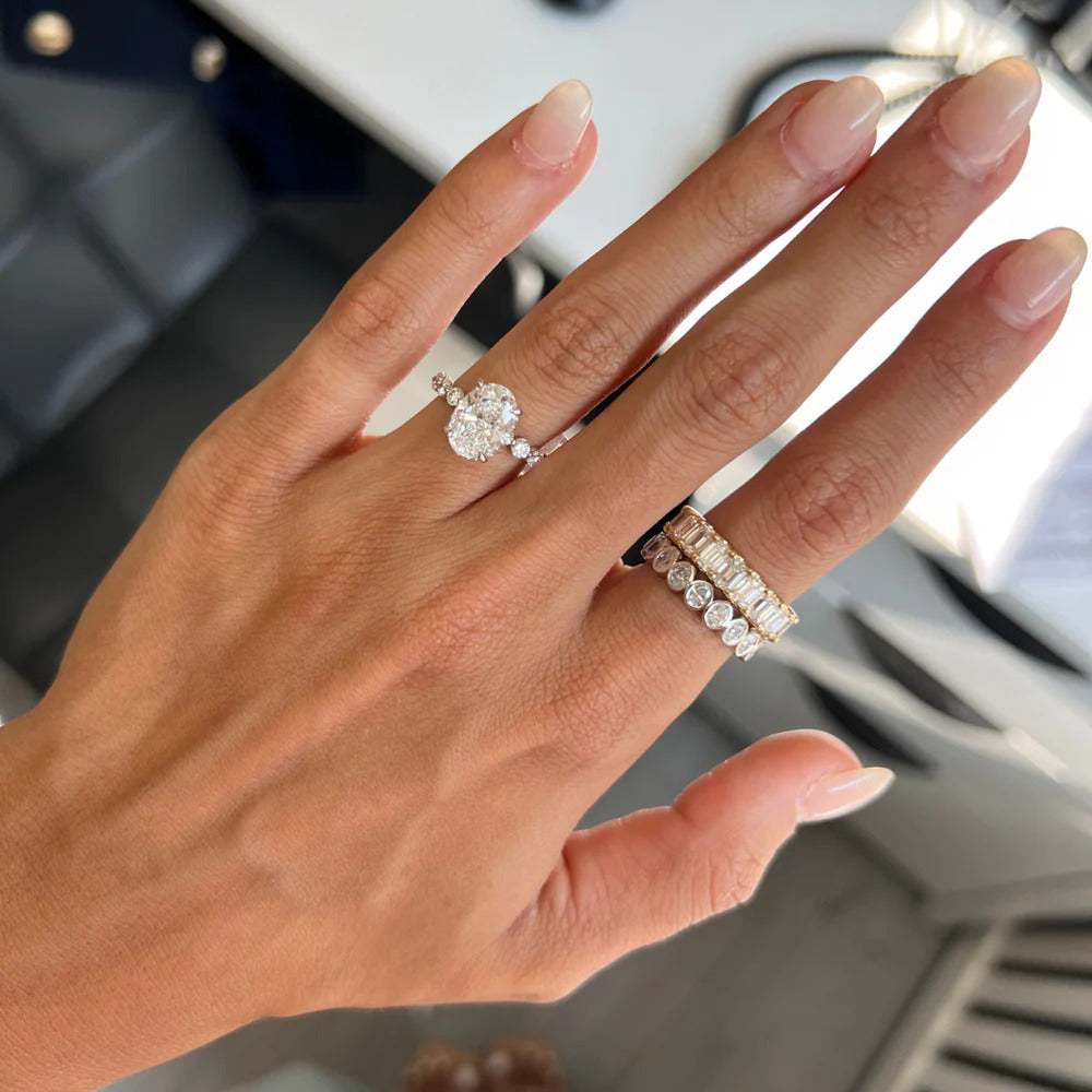 Lab-grown emerald cut eternity band stacked with emerald cut engagement ring