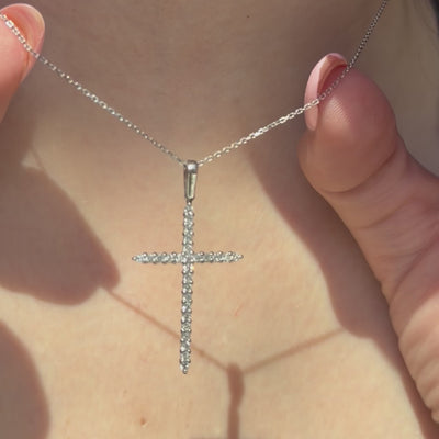 Petite diamond cross pendant in 14k white gold from Diana M Jewels — 0.10ct round diamonds, 0.50-inch length