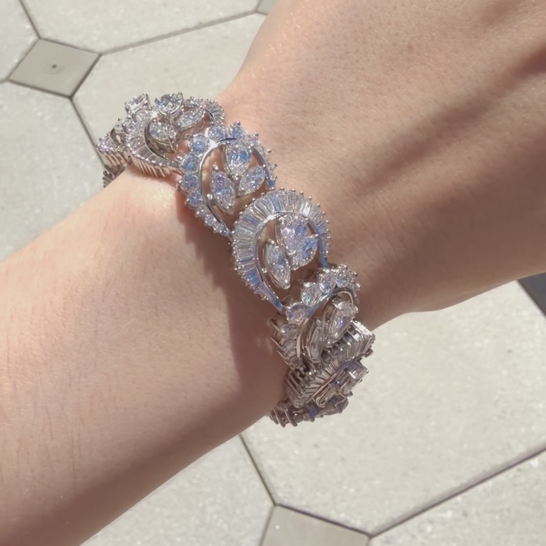 Video of  of multi-shape diamond bracelet in platinum with 37 carats of half-moon, round, baguette, pear, and marquise diamonds