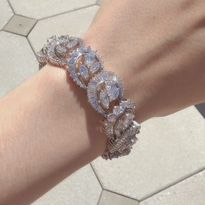 Video of  of multi-shape diamond bracelet in platinum with 37 carats of half-moon, round, baguette, pear, and marquise diamonds